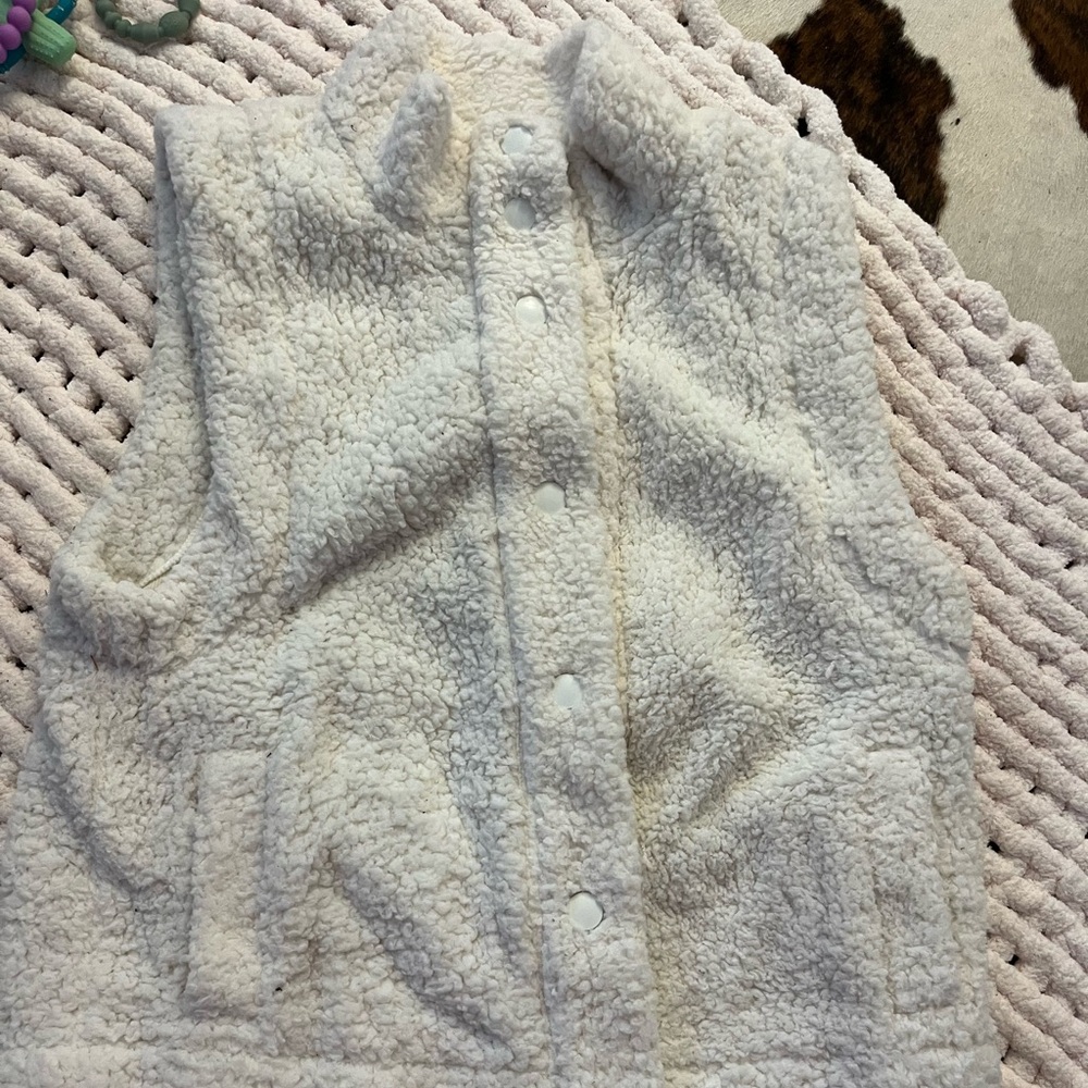 These three fuzzy vest